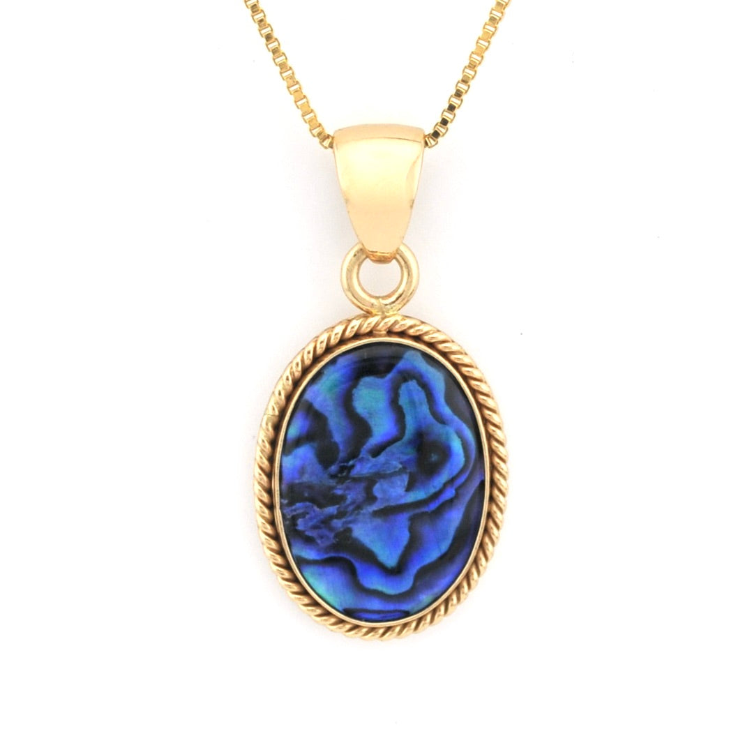 Gold necklace with a blue pendant on a white background