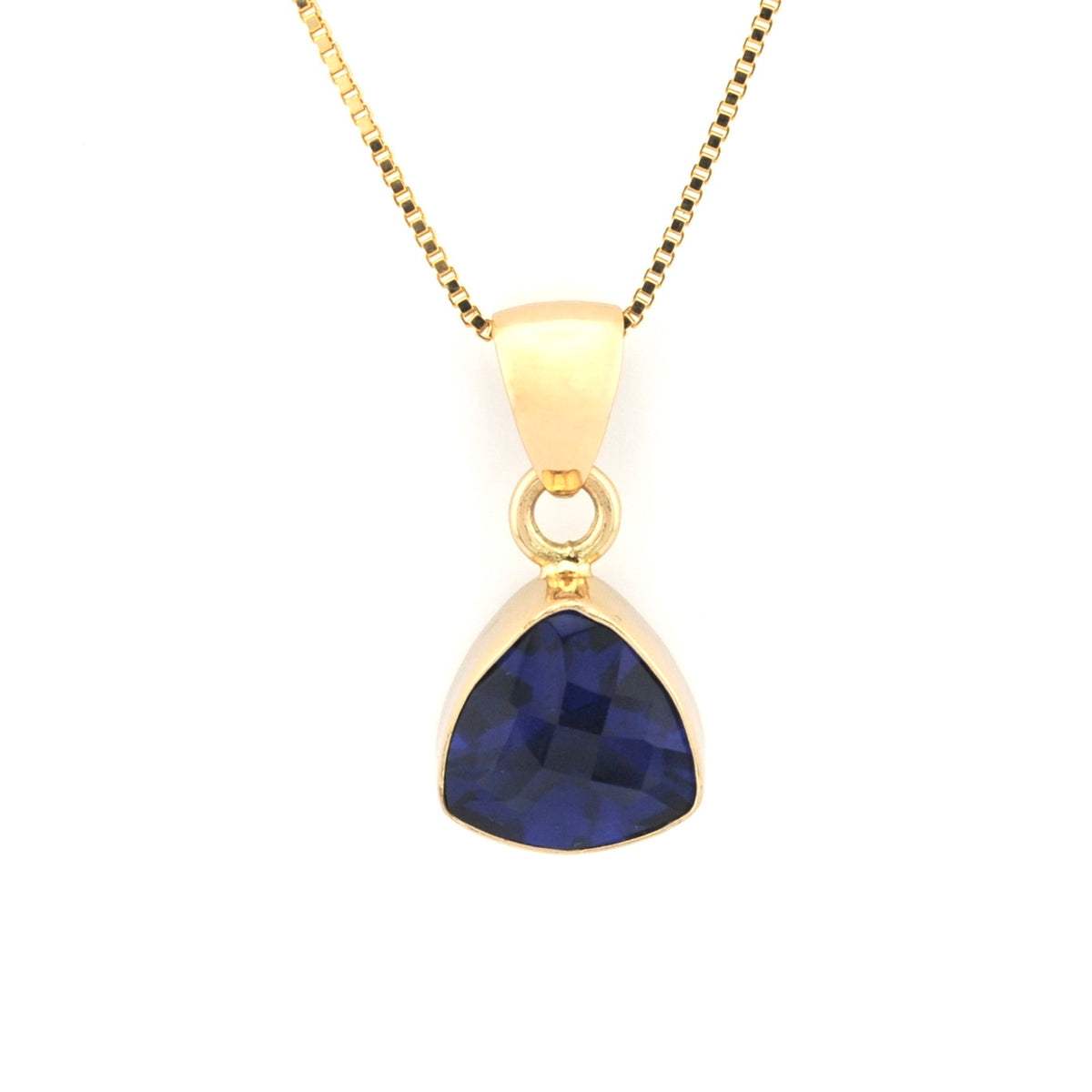 Trillion shaped tanzanite pendant on white background.