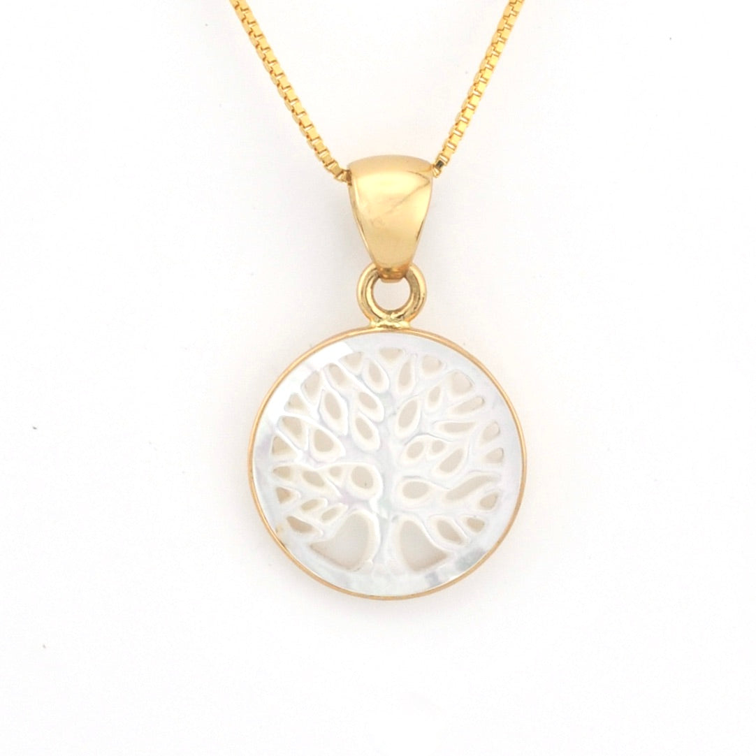 Gold necklace with a white tree-of-life pendant on a white background