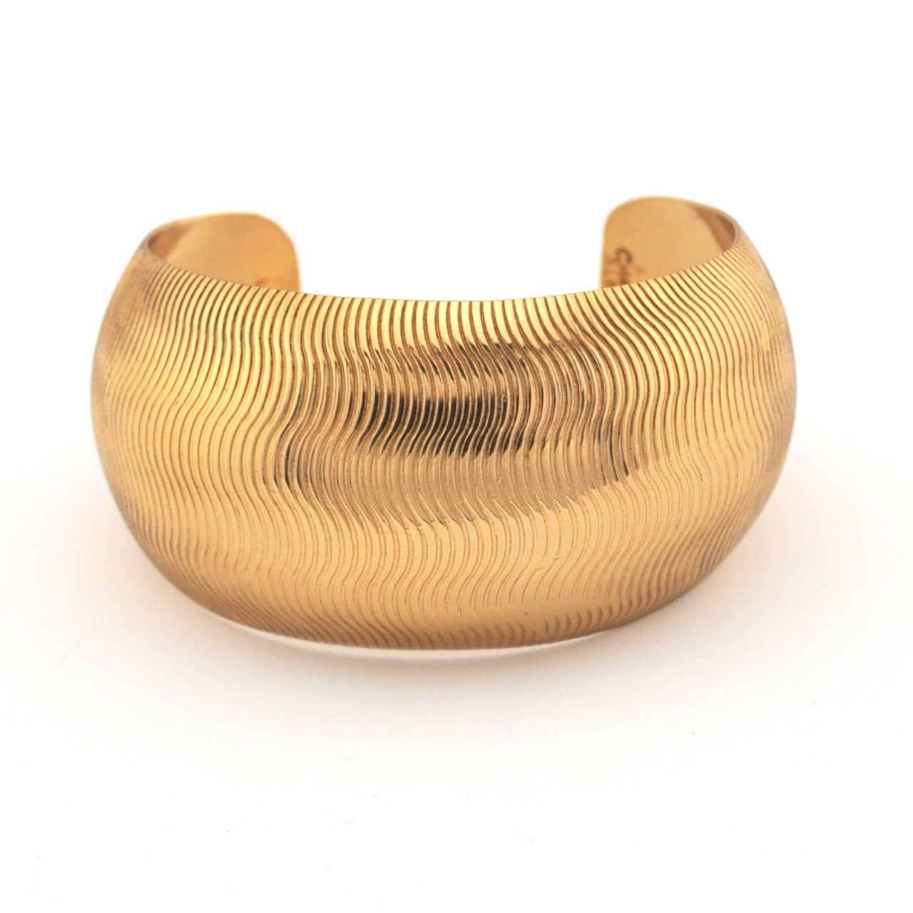 Gold bracelet on a white background