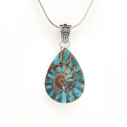 Teardrop-shaped pendant with blue and bronze design on a white background