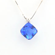 Blue pendant necklace on a white background