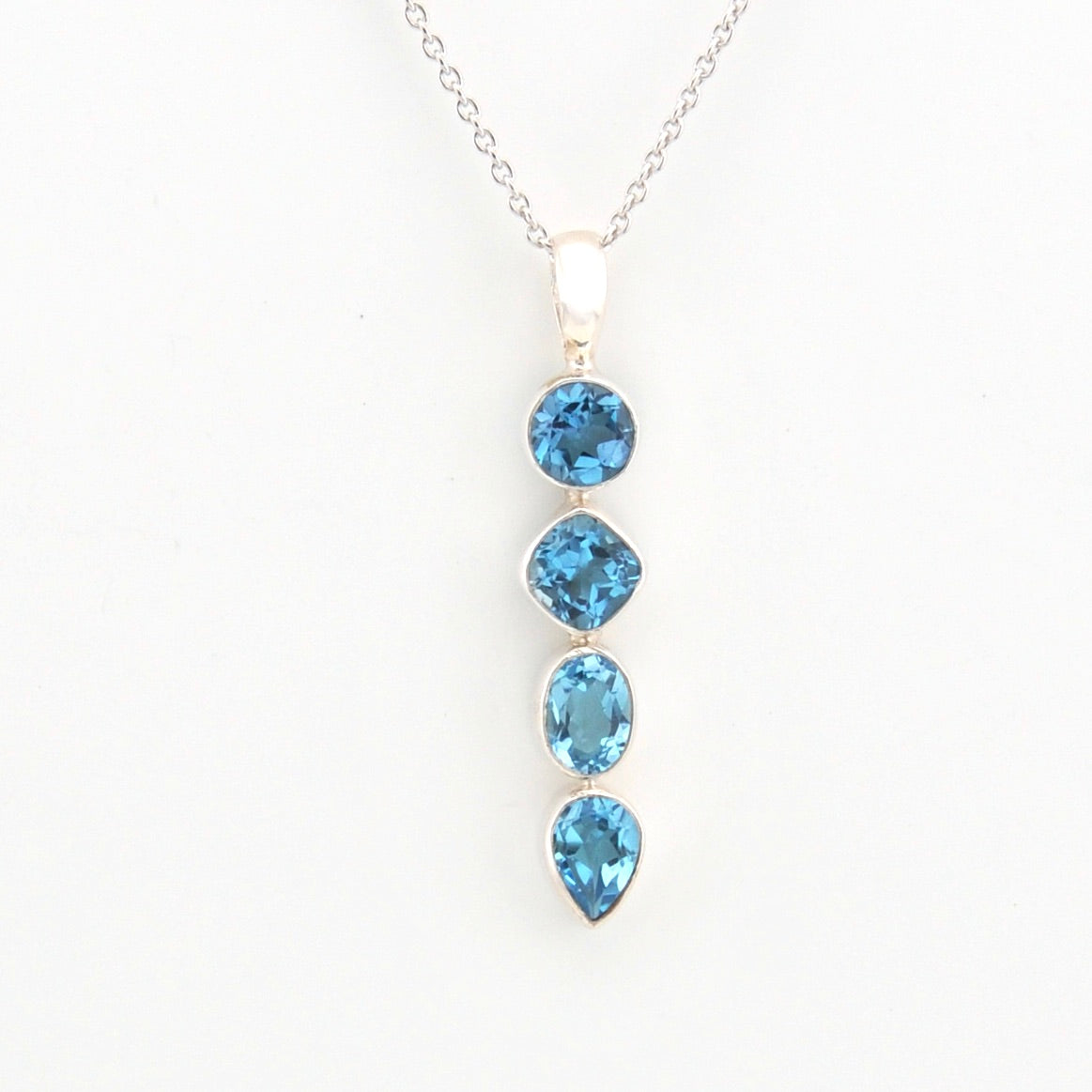 Necklace with blue gemstones on a white background