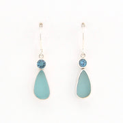 Teardrop-shaped earrings with blue stones on a white background