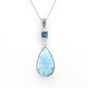 Necklace with a teardrop-shaped blue gemstone pendant on a white background