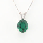 Green gemstone pendant on a white background