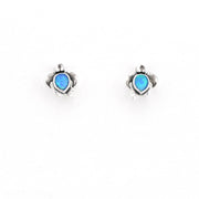 Turtle-shaped earrings with blue gemstones on a white background