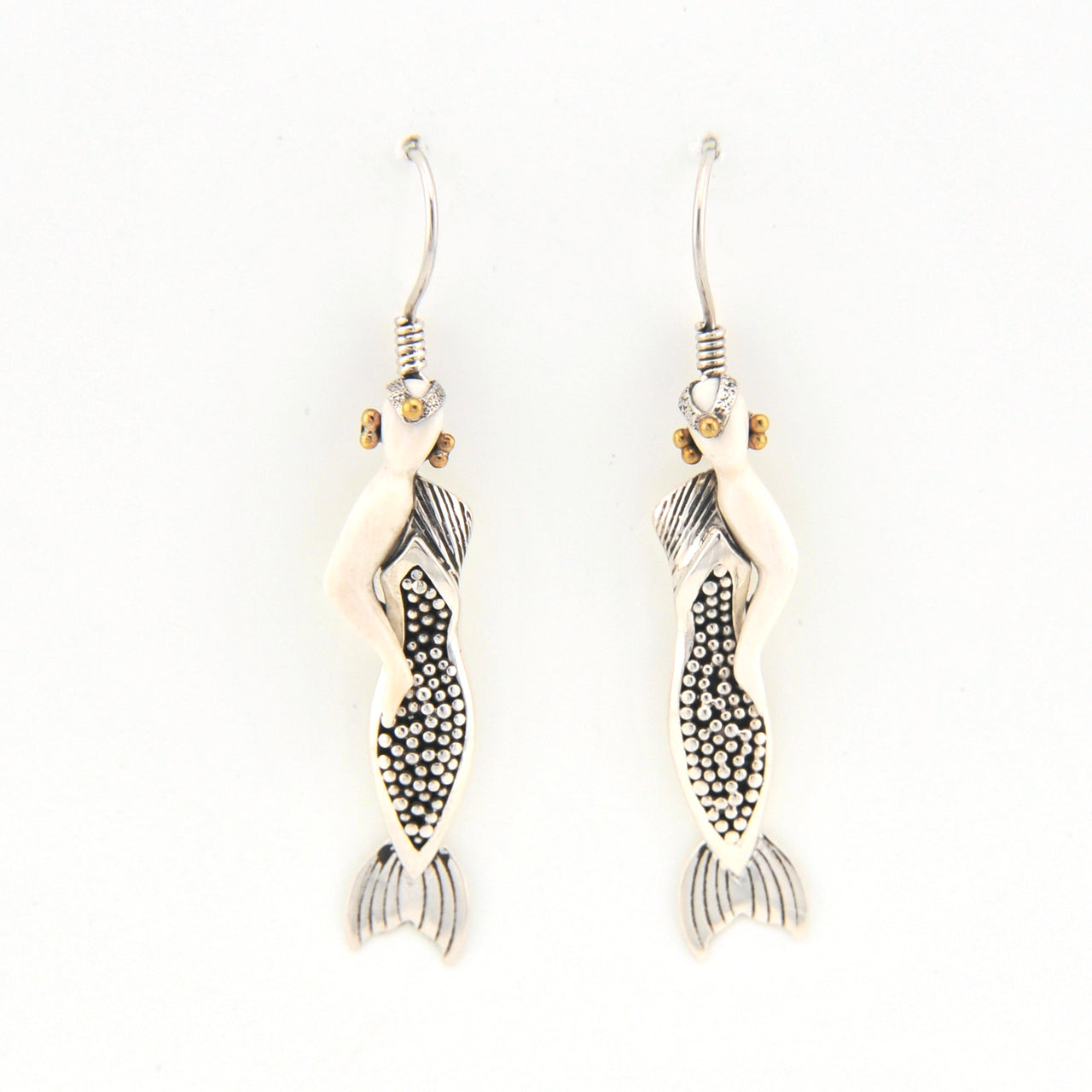 Mermaid earrings on a white background