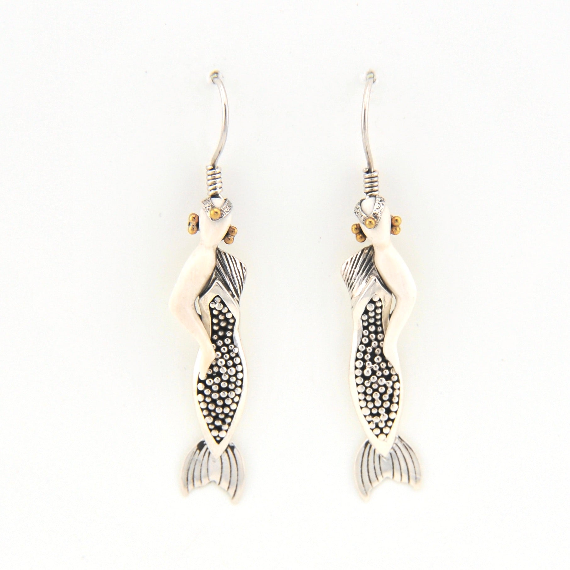 Mermaid earrings on a white background