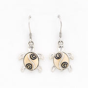 Sea turtle earrings on a white background