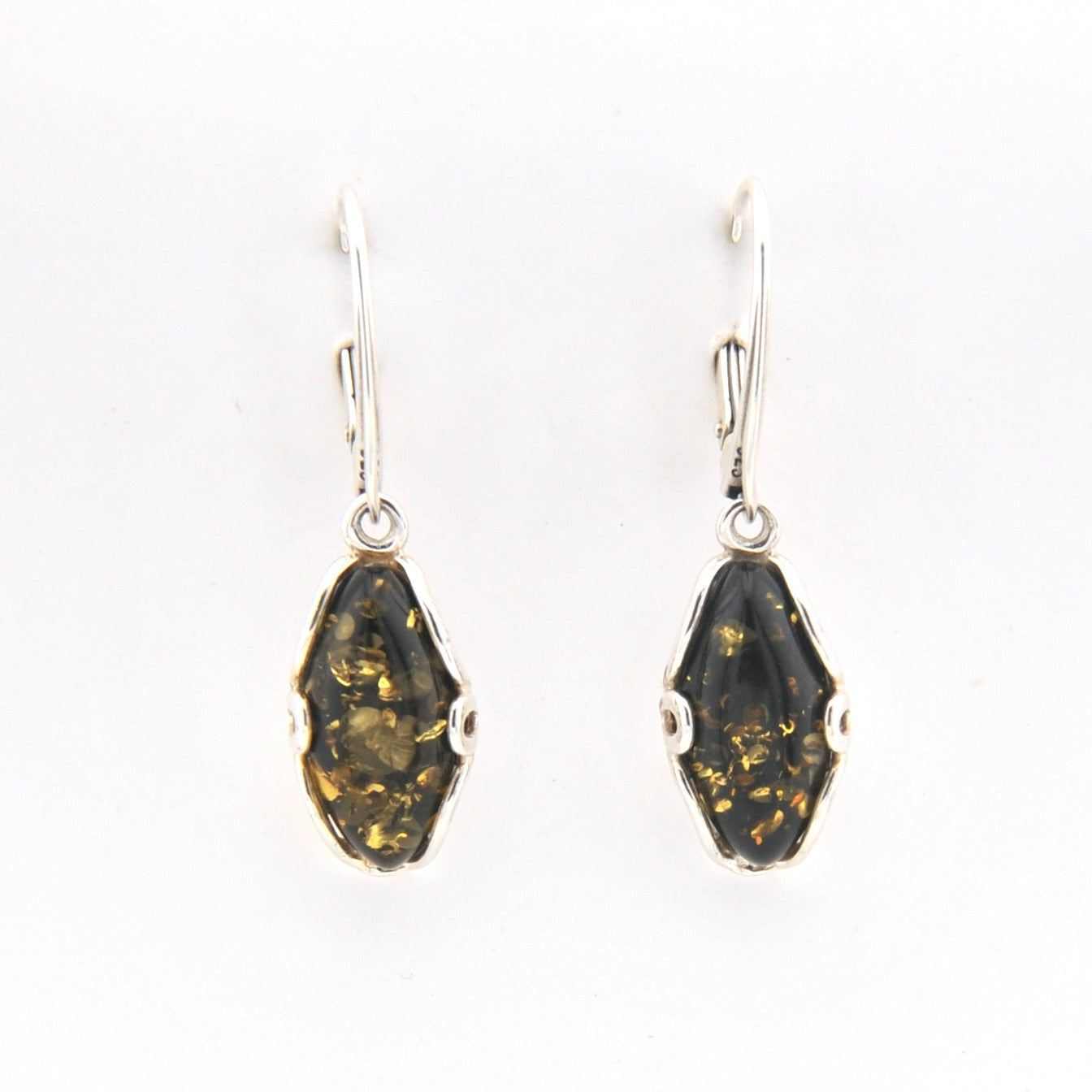 Pair of earrings with dark green stone and silver hooks on a white background