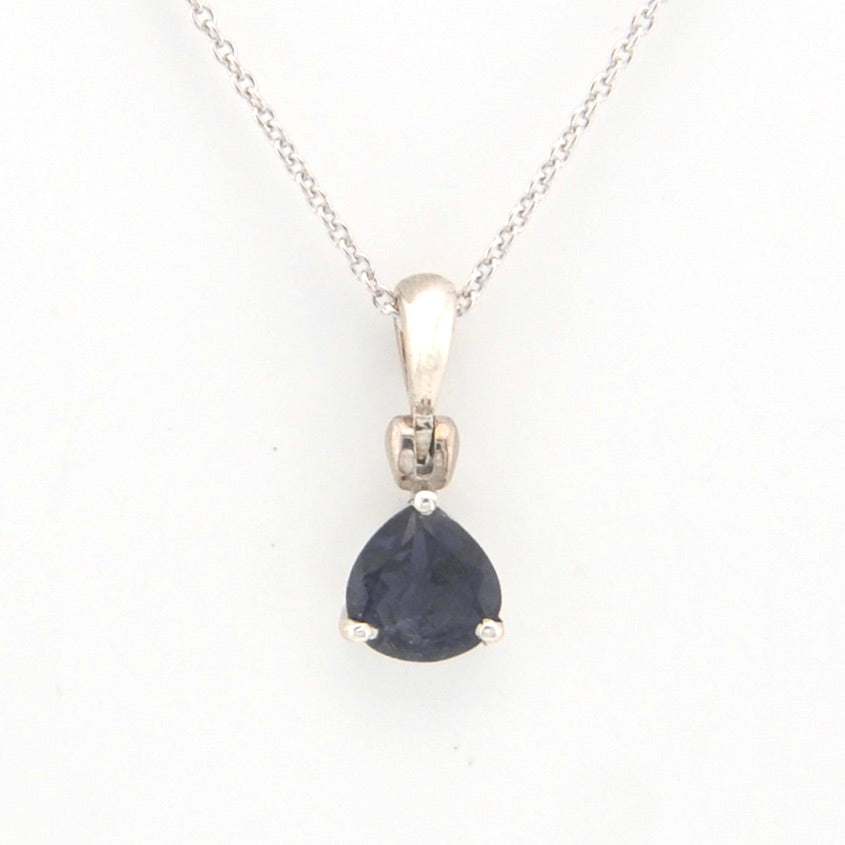 Silver pendant with a blue gemstone on a white background