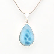 Teardrop-shaped blue pendant on a white background