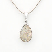 Teardrop-shaped pendant on a white background