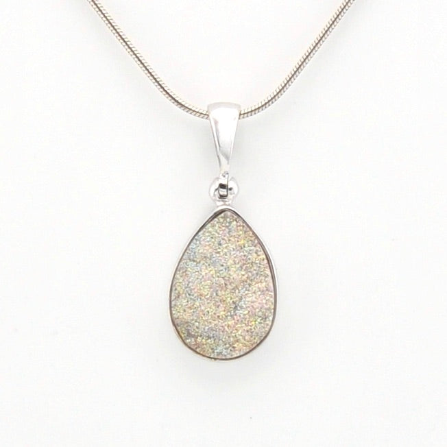 Teardrop-shaped pendant on a white background