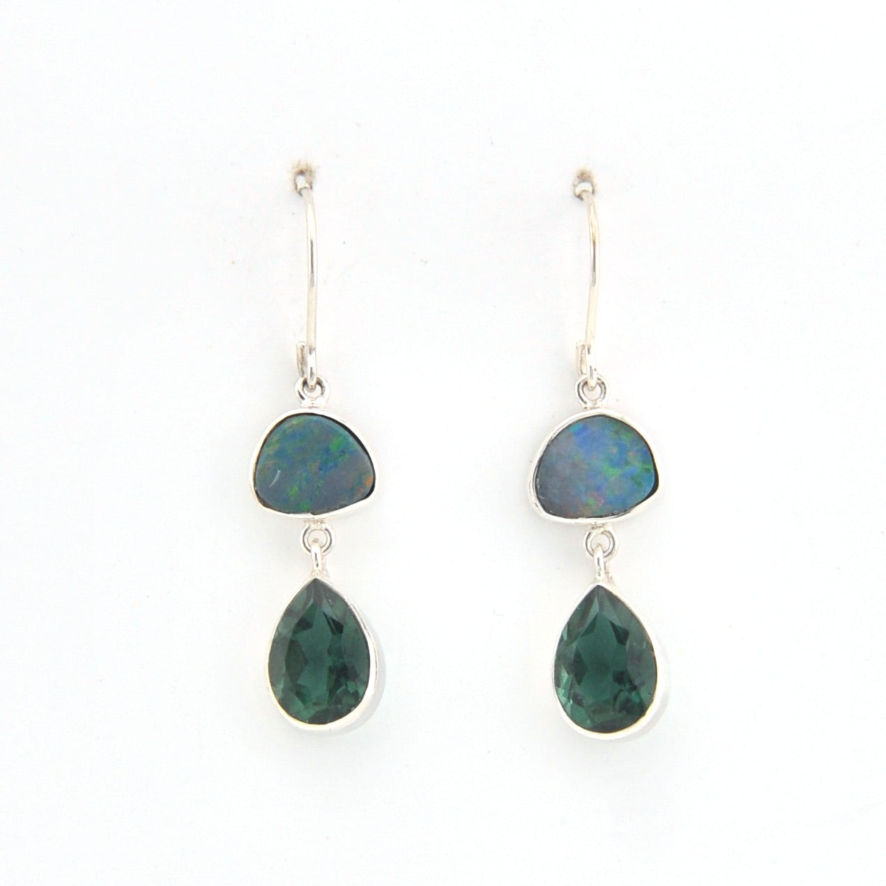 Pair of earrings with green teardrop-shaped stones on a white background