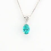 Teal pendant necklace on a white background