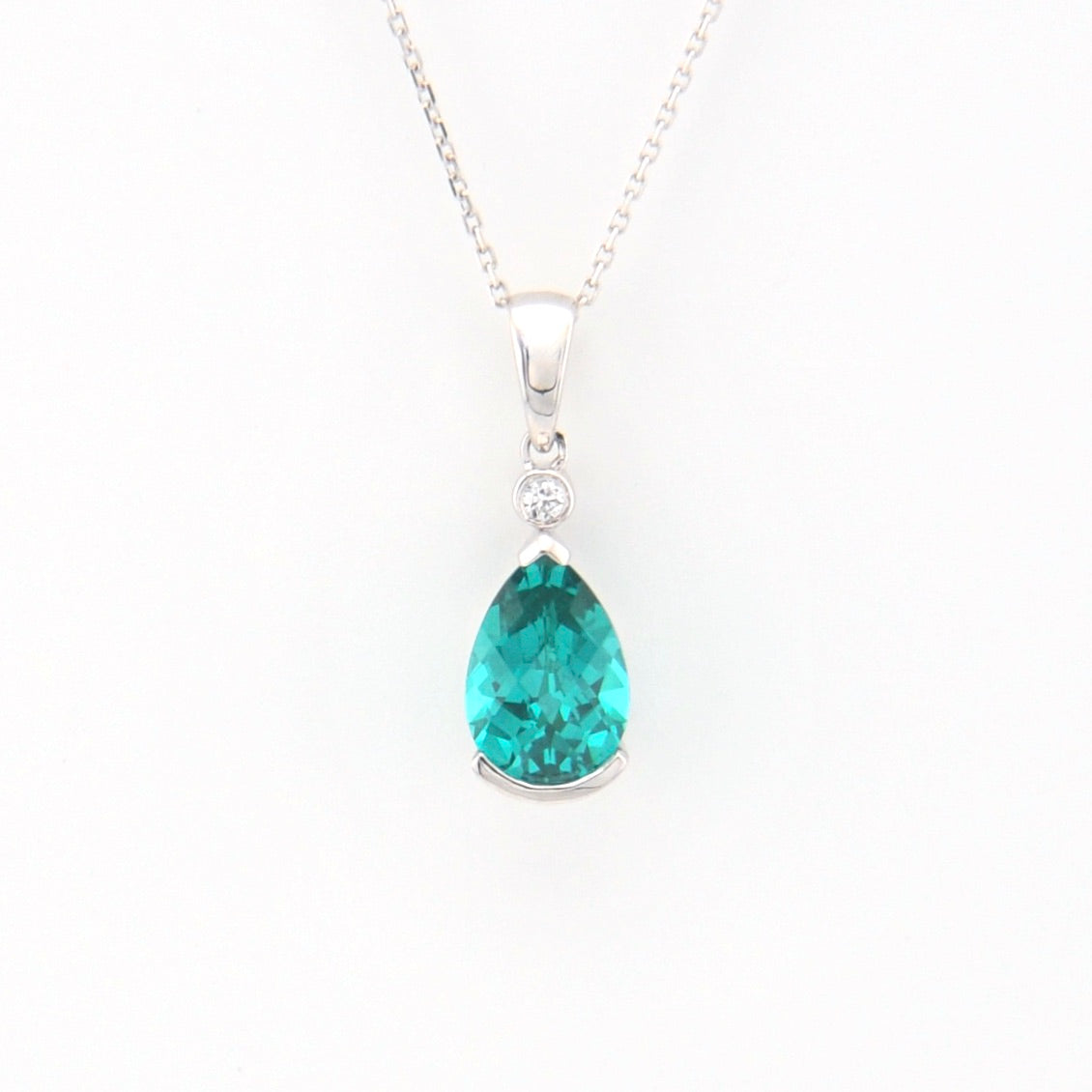 Teardrop-shaped gemstone pendant on a white background