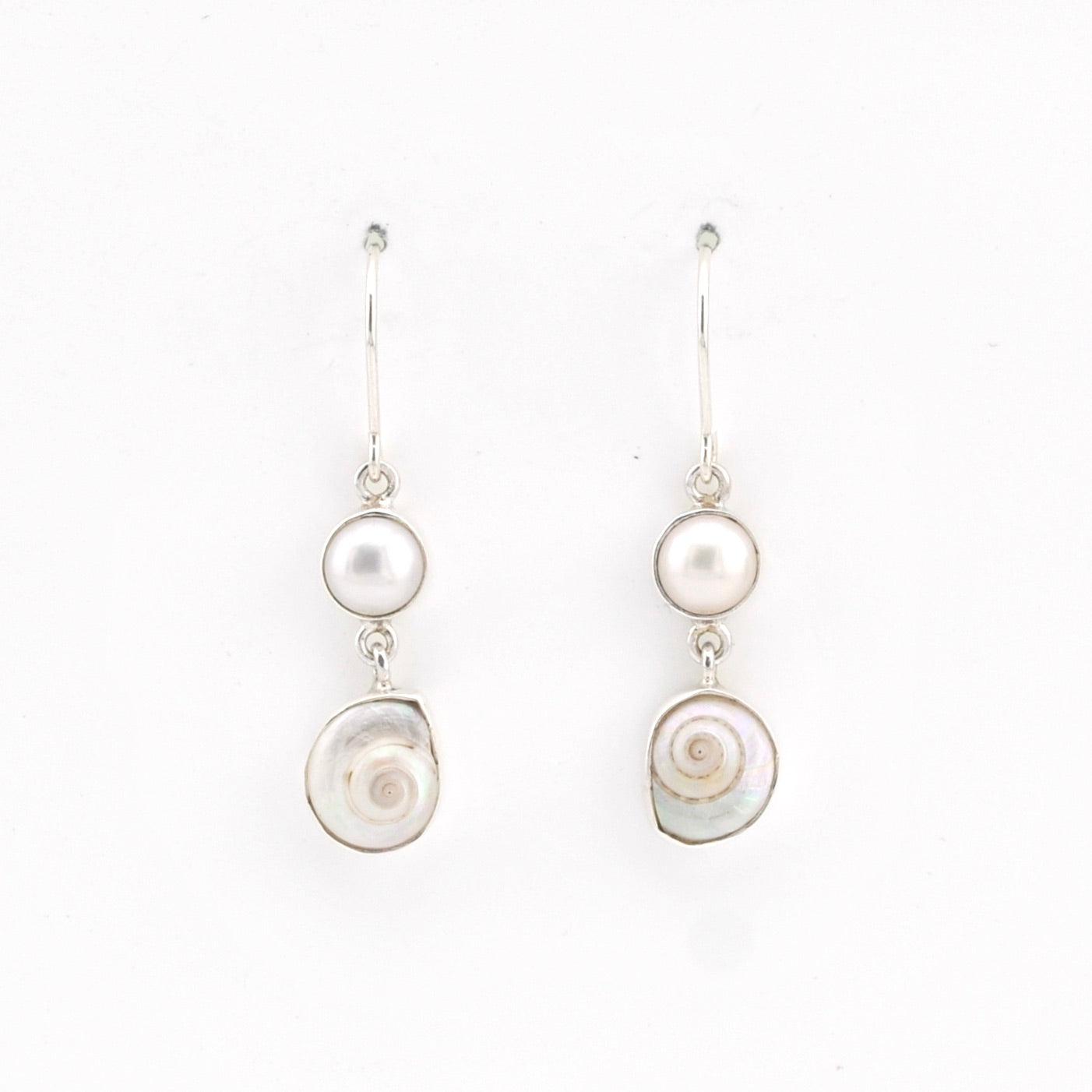 Pair of pearl earrings on a white background