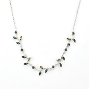 Necklace with green gemstones on a white background