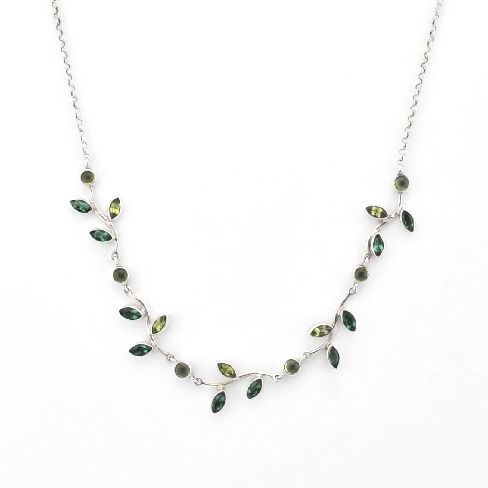 Necklace with green gemstones on a white background