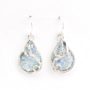 Teardrop-shaped earrings with a silver frame and light blue Roman glass on a white background