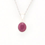 Necklace with a pink pendant on a white background
