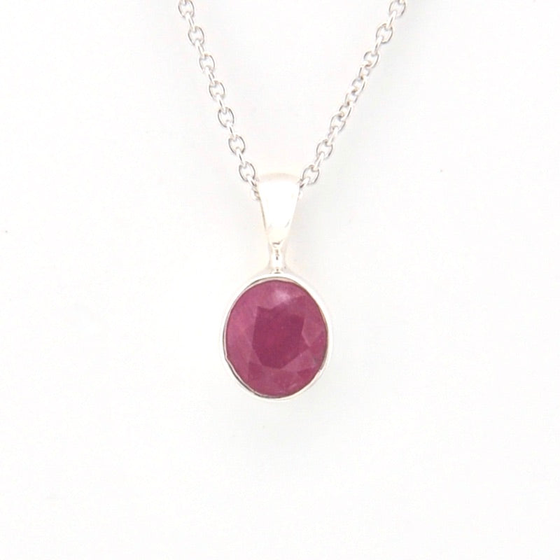 Necklace with a pink pendant on a white background