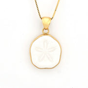 Gold pendant with a white stone on a white background