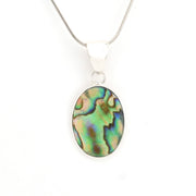 Oval abalone shell pendant on a silver chain against a white background