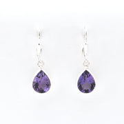 Silver earrings with amethyst teardrop stones on a white background