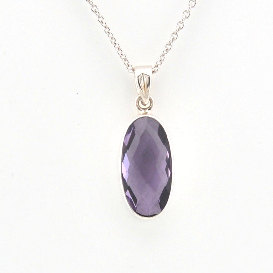 Necklace with a purple pendant on a white background