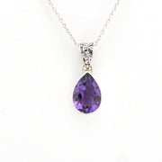 Purple teardrop pendant on a silver chain against a white background