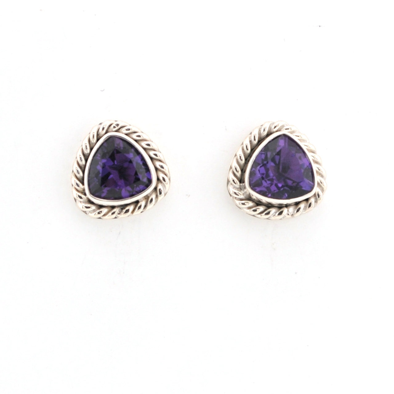 Pair of purple gemstone earrings with gold accents on a white background