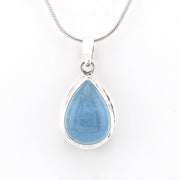 Teardrop-shaped blue pendant on a white background