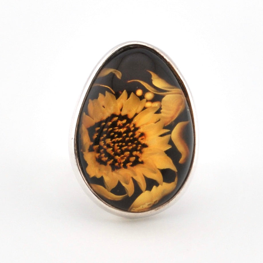 Sunflower design on a black background with silver frame