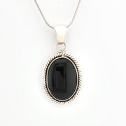 Black pendant necklace on a white background