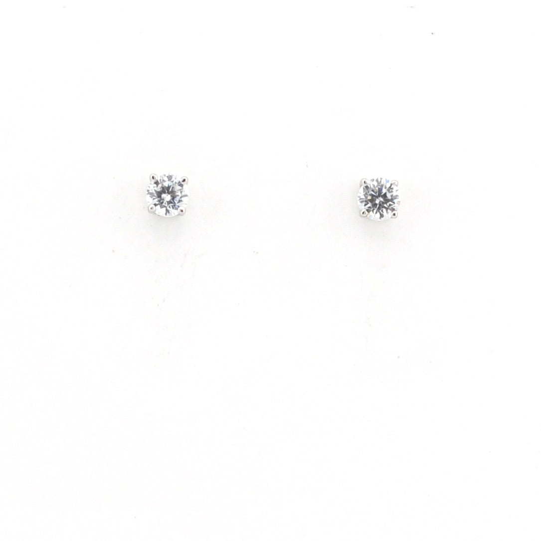 Pair of diamond stud earrings on a white background