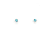 Pair of blue gemstone stud earrings on a white background