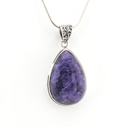 Teardrop-shaped purple stone pendant on a silver chain against a white background