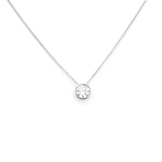 Silver necklace with a round pendant on a white background