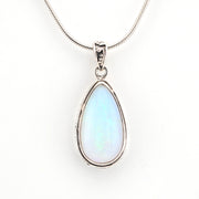 Teardrop-shaped pendant with a light blue gemstone on a white background