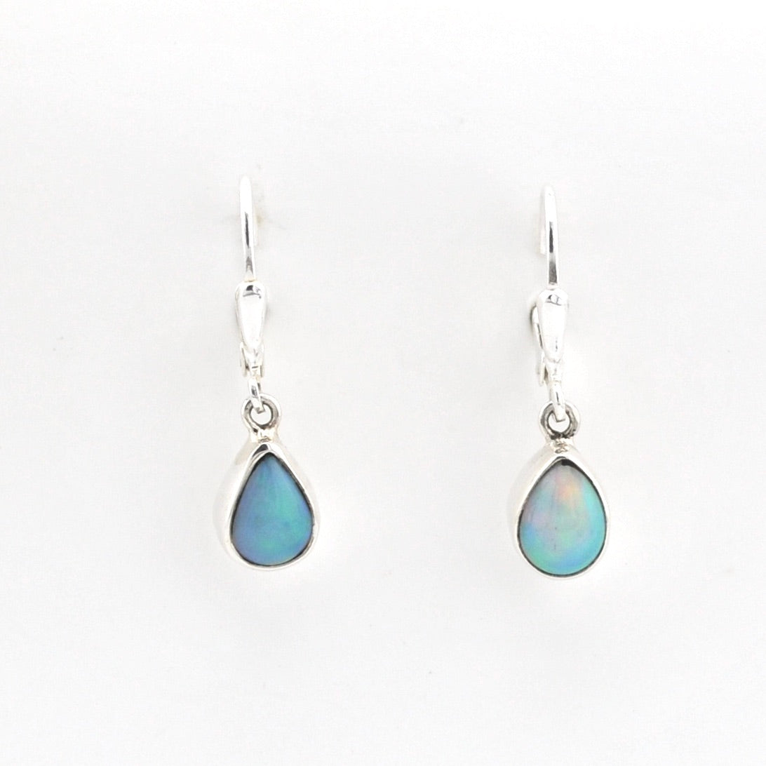 Teardrop-shaped opal earrings on a white background
