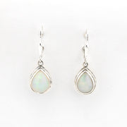 Teardrop-shaped earrings with light-colored gemstones on a white background