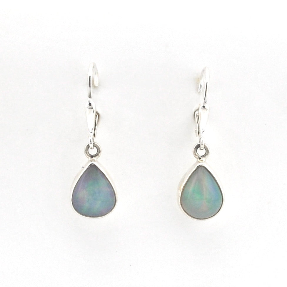 Teardrop-shaped opal earrings on a white background