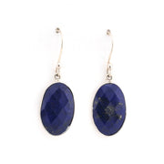 Pair of blue lapis oval earrings on a white background