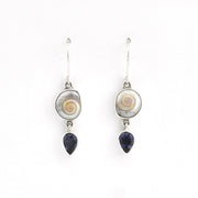 Pair of earrings with circular and teardrop-shaped stones on a white background