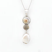 Necklace with a pendant featuring stones on a white background