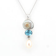 Necklace with a pendant featuring a blue gemstone and pearl on a white background