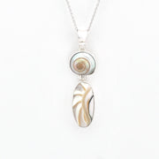 Necklace with a pendant featuring two oval stones on a white background